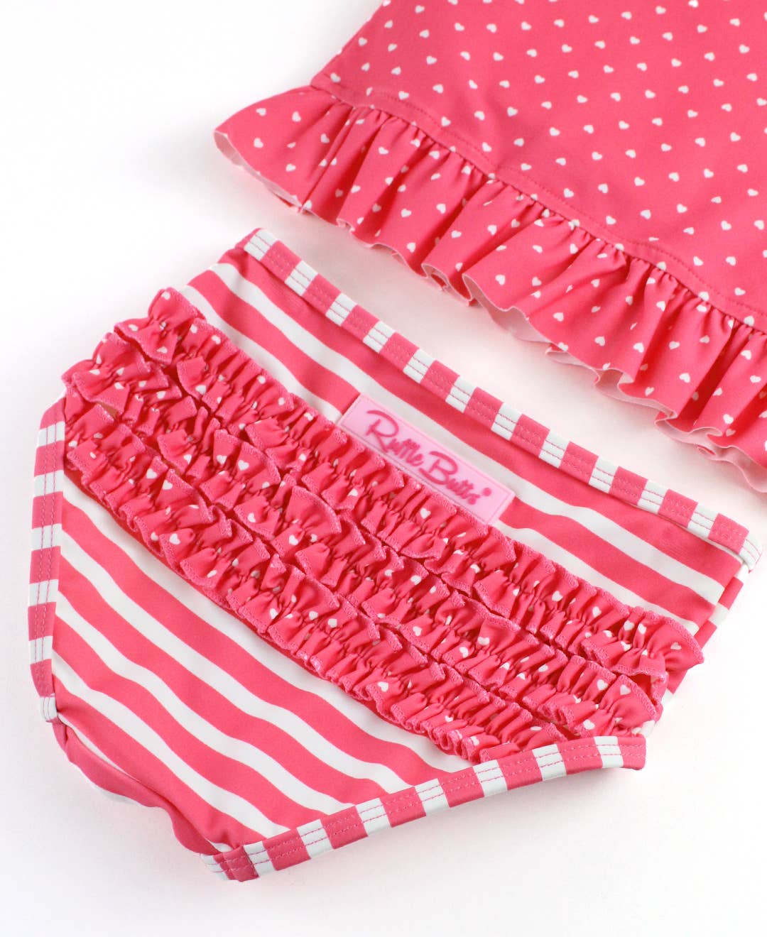 RuffleButts + RuggedButts - Girls Hot Pink Heart Polka Dot Long Sleeve Rash Guard 2-Piece Swimsuit with Signature Rear Ruffles